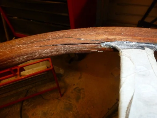 Jaguar E-Type steering wheel as received with cracks in original wooden rim