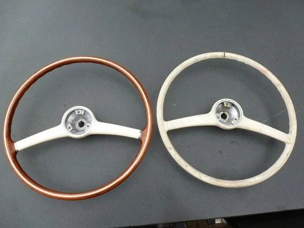 Mercedes 190 SL original unrestored steering wheel beside restored example