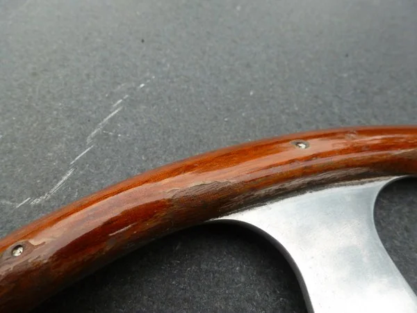Porsche 356 Nardi steering wheel before restoration with deteriorated clear coat