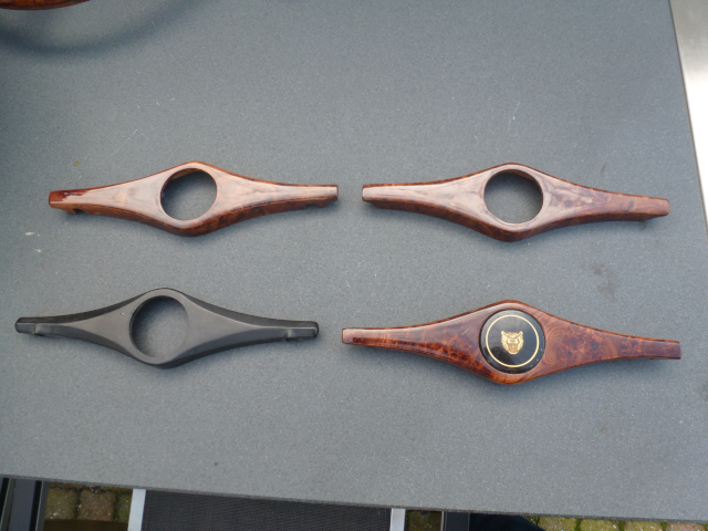 Original horn cover next to wooden recreations