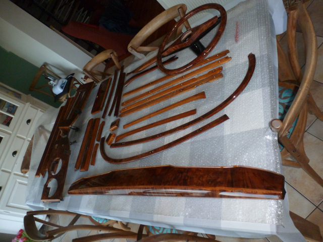 Burl walnut rimmed steering wheel with restored dashboard and other interior wood panels